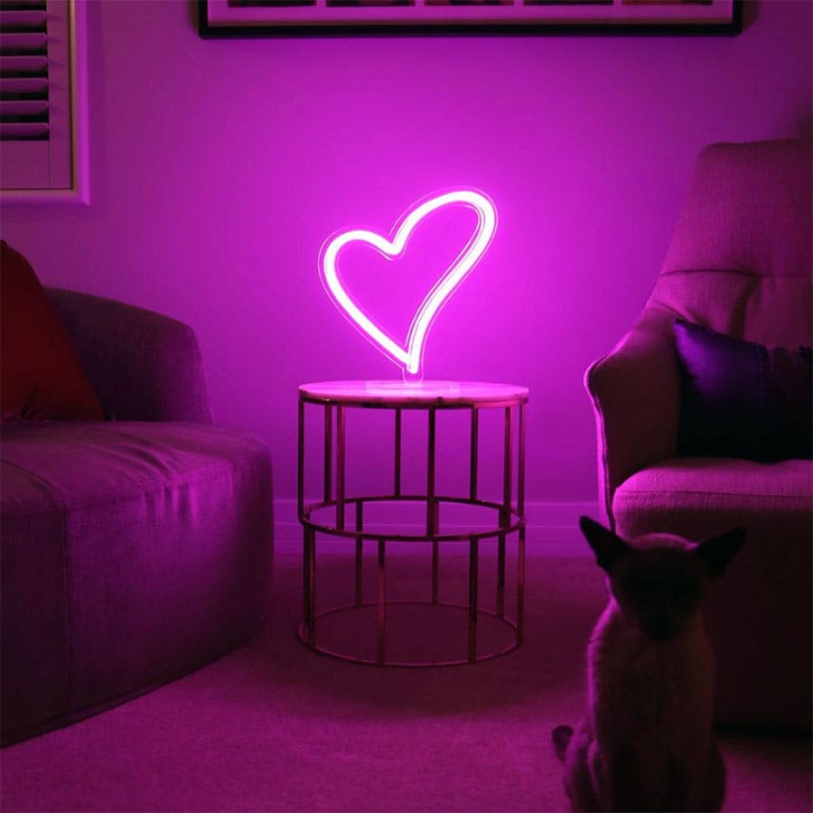 Pink neon heart in living room